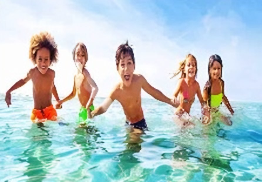 Kids swimming in clear water